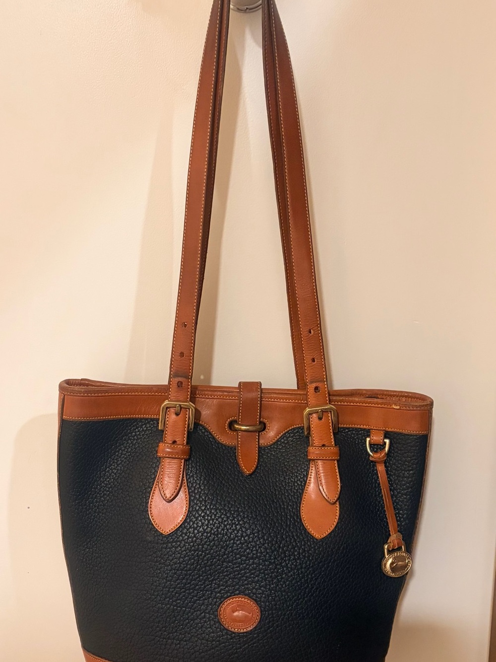 Dooney & Bourke Black and Brown Pebbled Leather Tote with Brass Accents